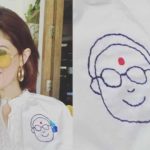 Twinkle Khanna shows off her embroidered shirt.